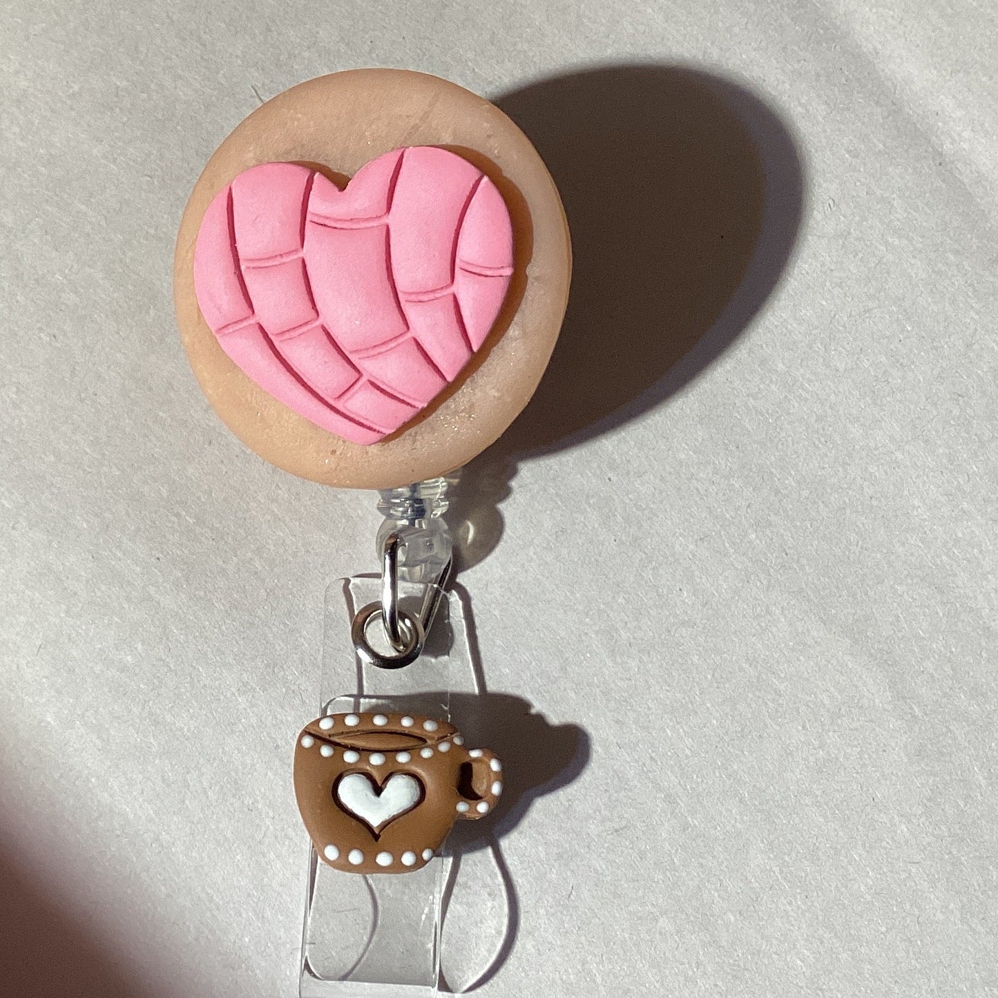 Heart-shaped concha retractable badge holder with coffee cup dangle for ID badges