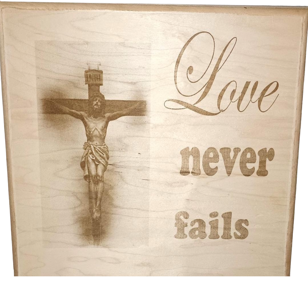 Plaque Love Never Fails Jesus on Cross Maple Wood Lasered Wall Art 12 X 12