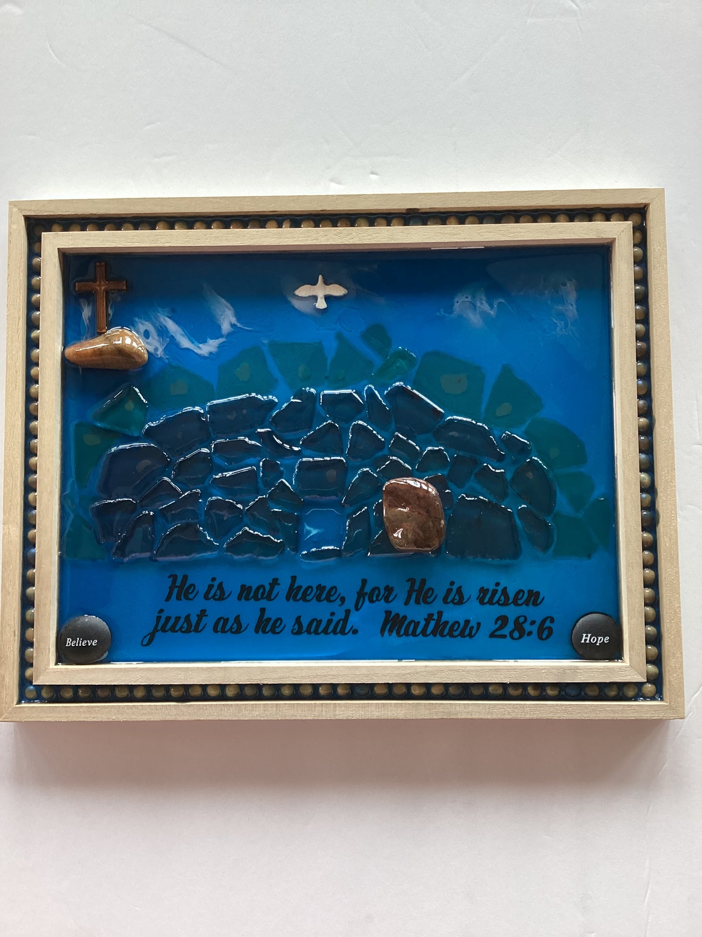 Resin wood plaque with "He Is Risen" inscription, 14x11 inches, Catholic Christian devotional gift by Brigitte Rosson.