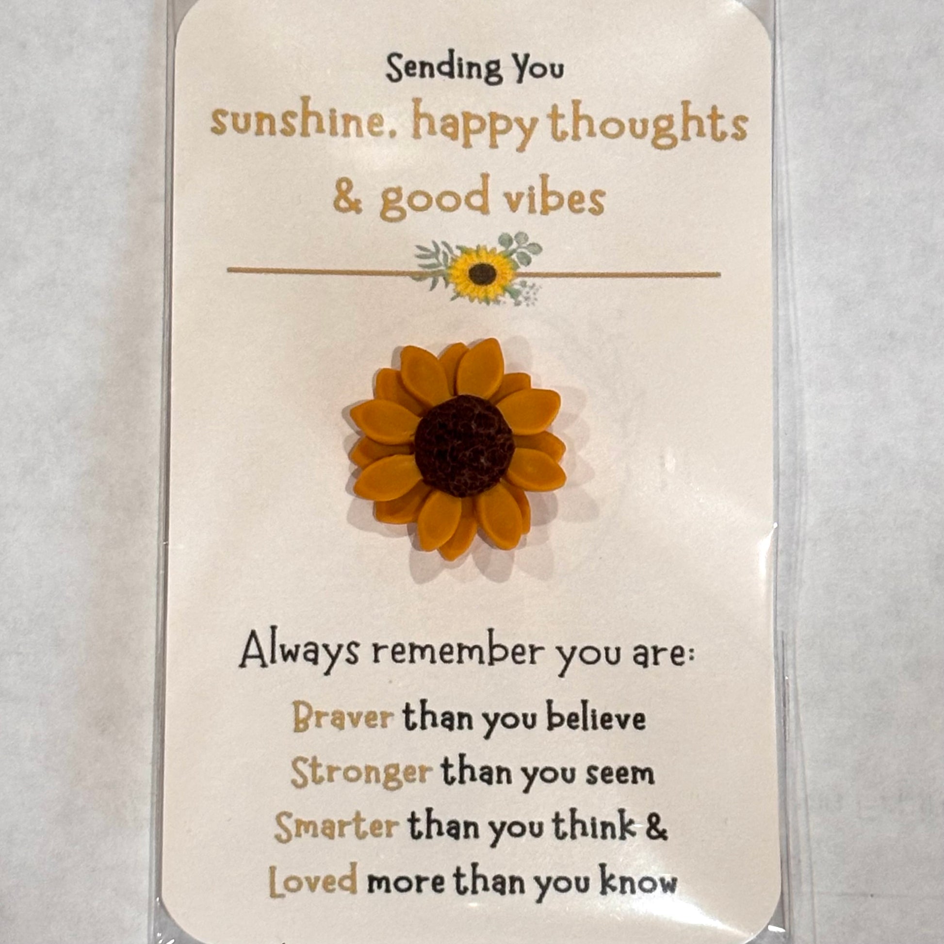 Handmade polymer clay sunflower pocket hug card from Melissa Cortinas, measuring 3x2 inches, designed as an emotional support gift.