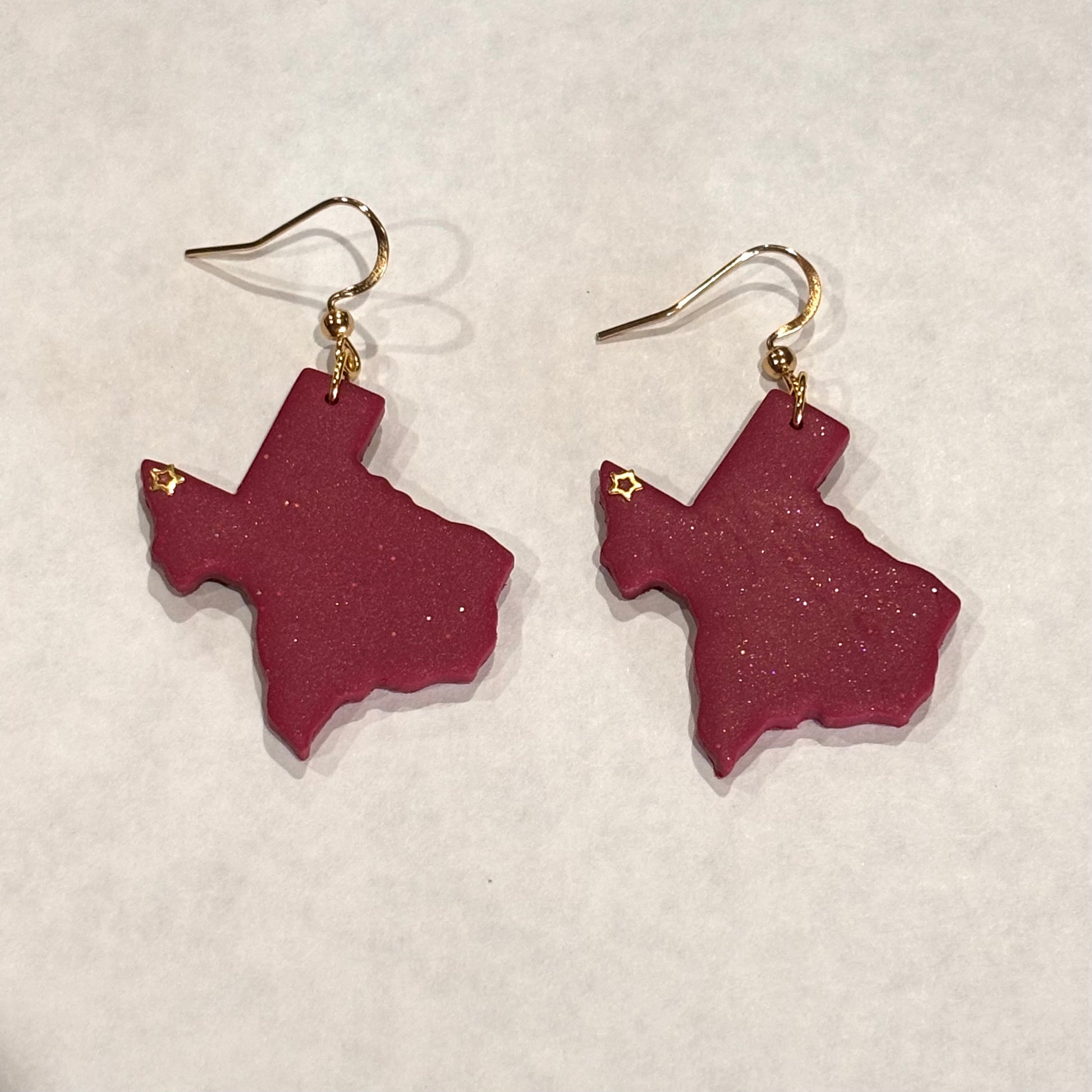 Melissa Cortinas El Paso Texas polymer clay dangle earrings featuring colorful, handcrafted jewelry with vibrant design details.