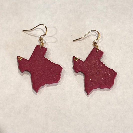 Melissa Cortinas El Paso Texas polymer clay dangle earrings featuring colorful, handcrafted jewelry with vibrant design details.