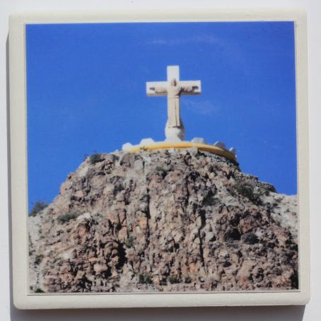 Ceramic Mt Cristo Rey coaster with cork backing, 4x4 inches, from Ysleta Mission Gift Shop, featuring detailed religious artwork.