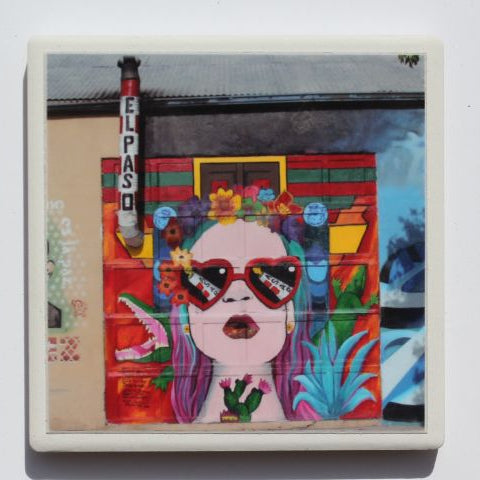 Ceramic El Paso mural coaster with cork backing, 4x4 inches, from Ysleta Mission Gift Shop, featuring colorful desert scene design.