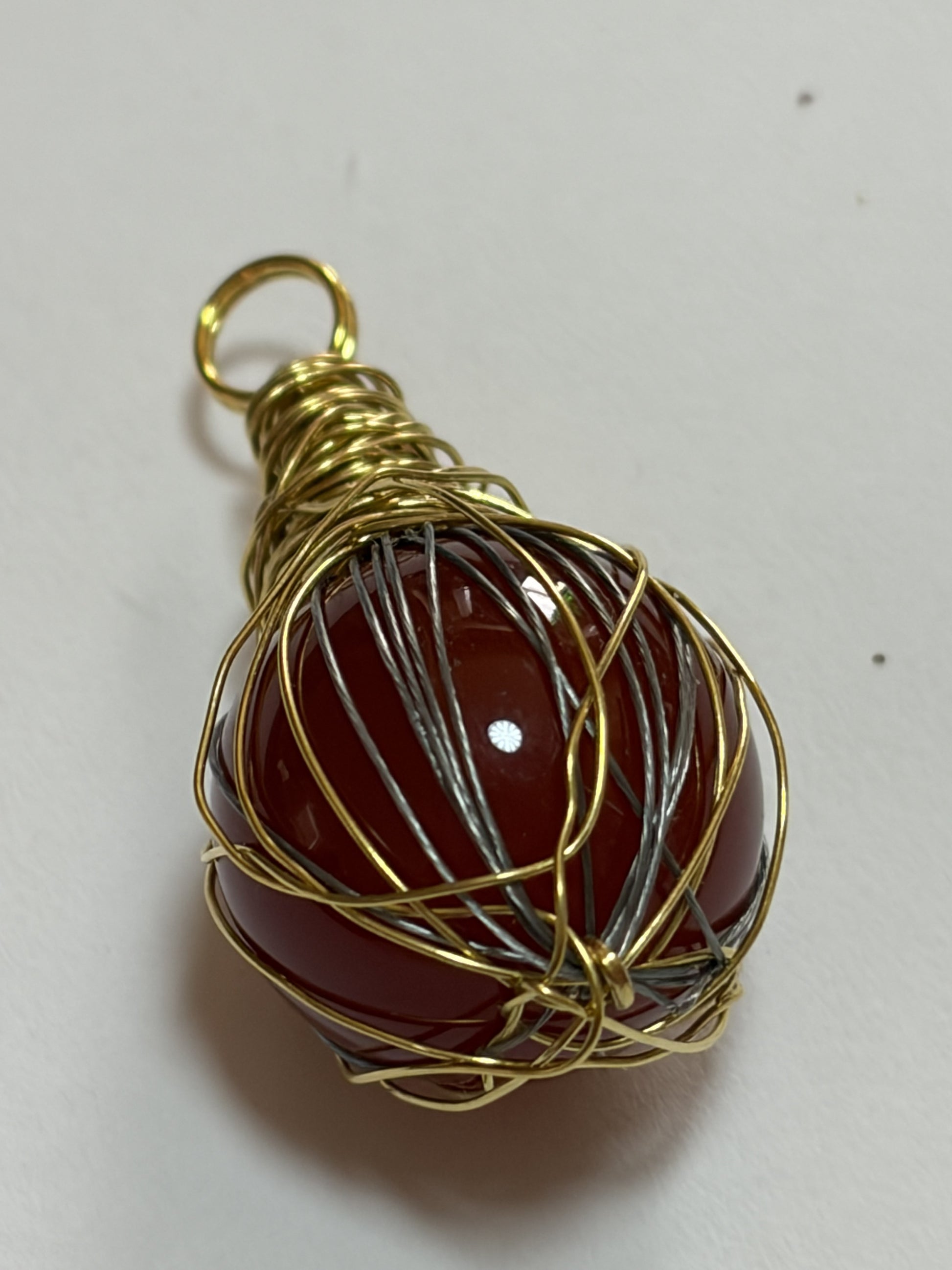 Handmade Sylvia Leroux couples stone bracelet with 8mm round beads, featuring orange carnelian stones and gold wire wrapping.