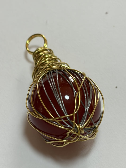 Handmade Sylvia Leroux couples stone bracelet with 8mm round beads, featuring orange carnelian stones and gold wire wrapping.