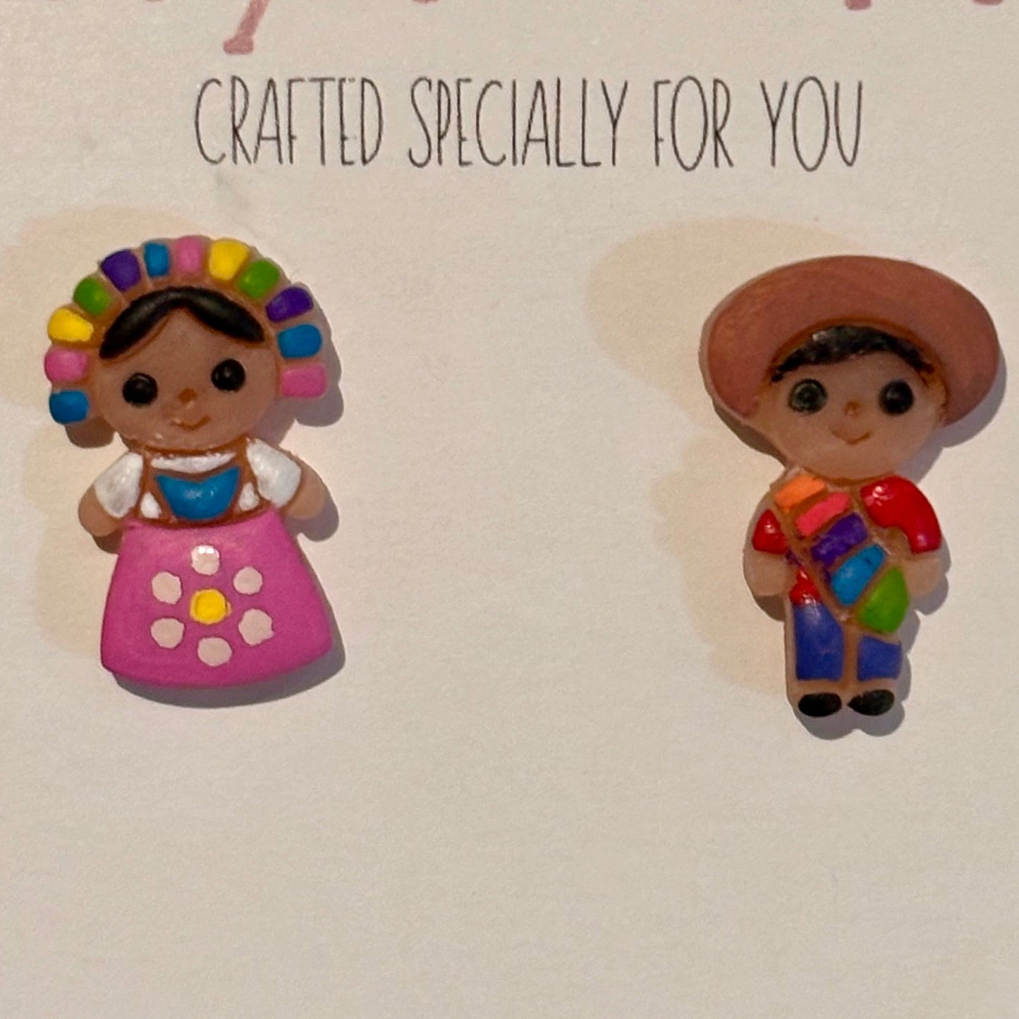 Handcrafted polymer clay Mexican doll stud earrings with stainless steel posts, colorful and detailed jewelry by Ysleta Mission Gift Shop.