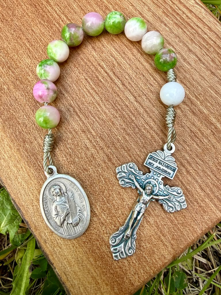 Saint Cecilia jade Catholic pocket rosary with one decade, featuring green jade beads and a metal crucifix, compact and portable.