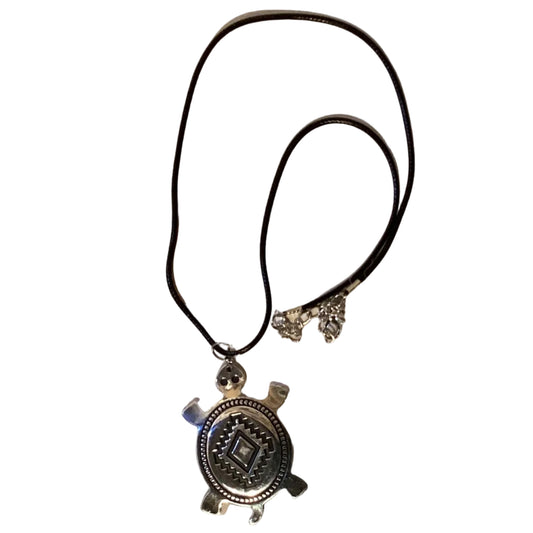 Silver-tone turtle pendant necklace with Southwestern geometric design on black cord, 18-inch jewelry by Ysleta Mission Gift Shop.