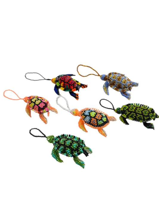 Handmade Mexican beaded turtle ornament by Jose Alberto Chavez, featuring intricate seed bead design for bag accessories.