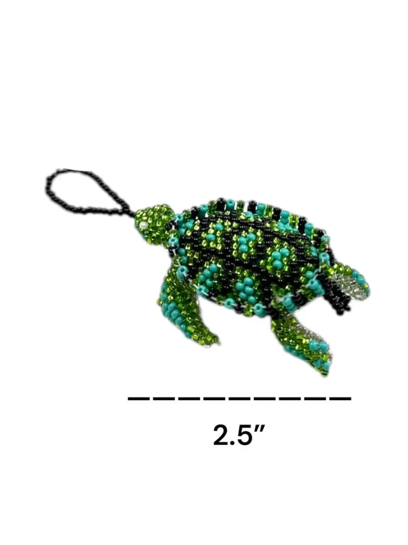 Handmade Mexican beaded turtle ornament with intricate seed bead design, crafted by Jose Alberto Chavez, ideal as a bag accessory.