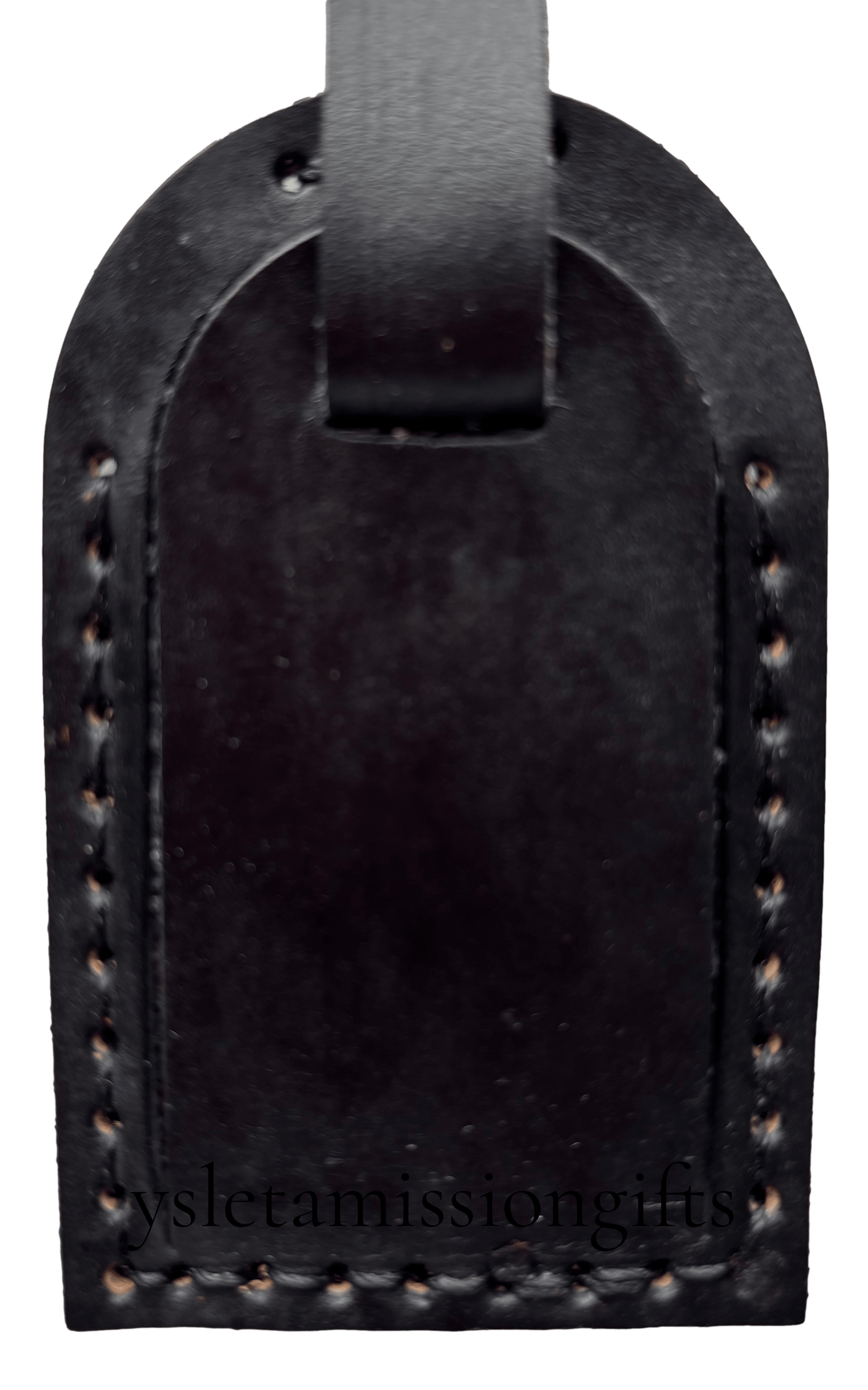 Black leather luggage tag by Consuelo Barraza, designed for travel accessories, with a sleek and durable appearance.