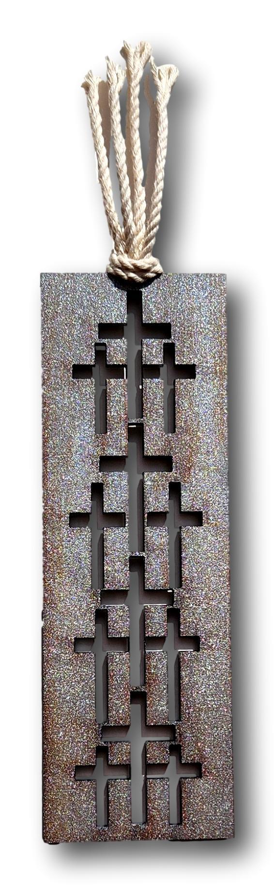 Assorted wood laser-cut bookmarks with Christian symbols and faith-themed designs, 6x2 inches, by Norma Cordova De Schaefer.