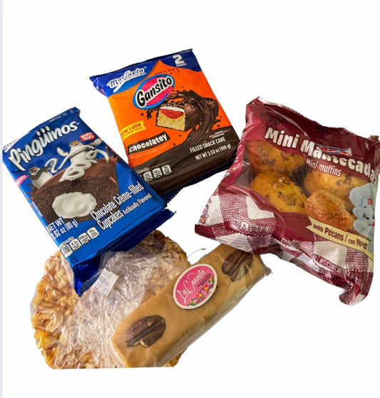 Assorted Michelle Miranda sweets and treats snack foods in colorful packaging on a white background.