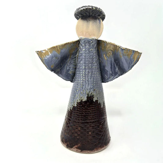 Minimalist ceramic angel sculpture with metallic halo by Vanessa Clark, featuring a smooth white finish and delicate angelic details.