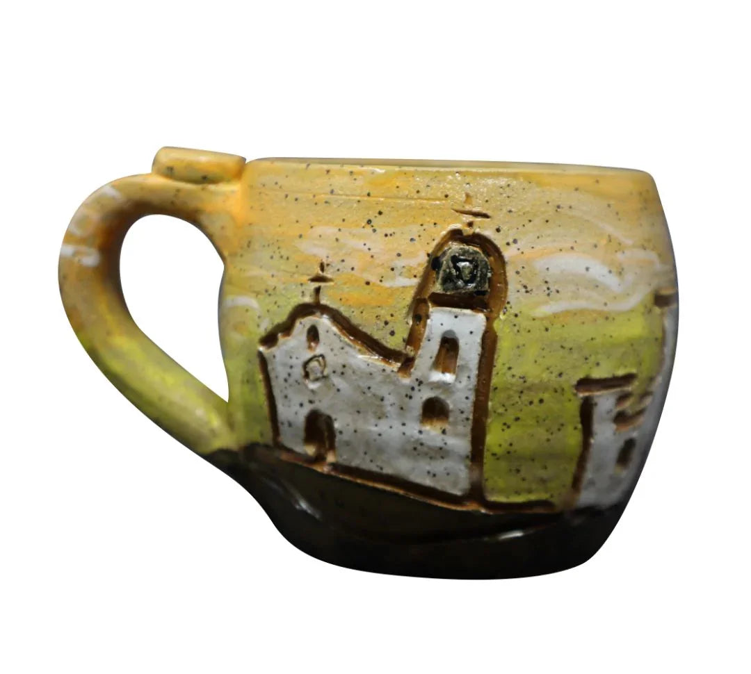 Hand-carved ceramic mug featuring El Paso Mission Trail design by Vanessa Clark, perfect for souvenirs and gift collections.