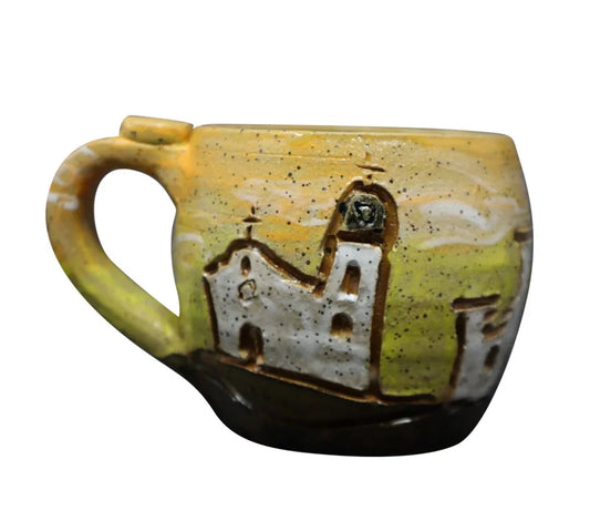 Yellow ceramic mug with hand carved El Paso Mission Trail design by Vanessa Clark, ideal for souvenirs and gifts.