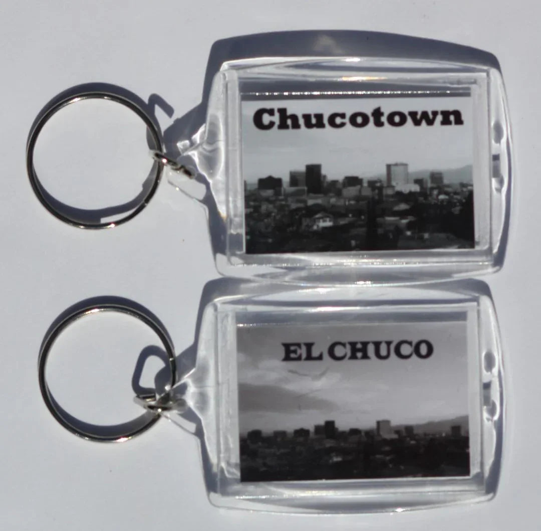 Black and white acrylic photo key chain by Miguel Martinez featuring double-sided El Paso souvenirs, 2 1/8 x 1 1/2 inches
