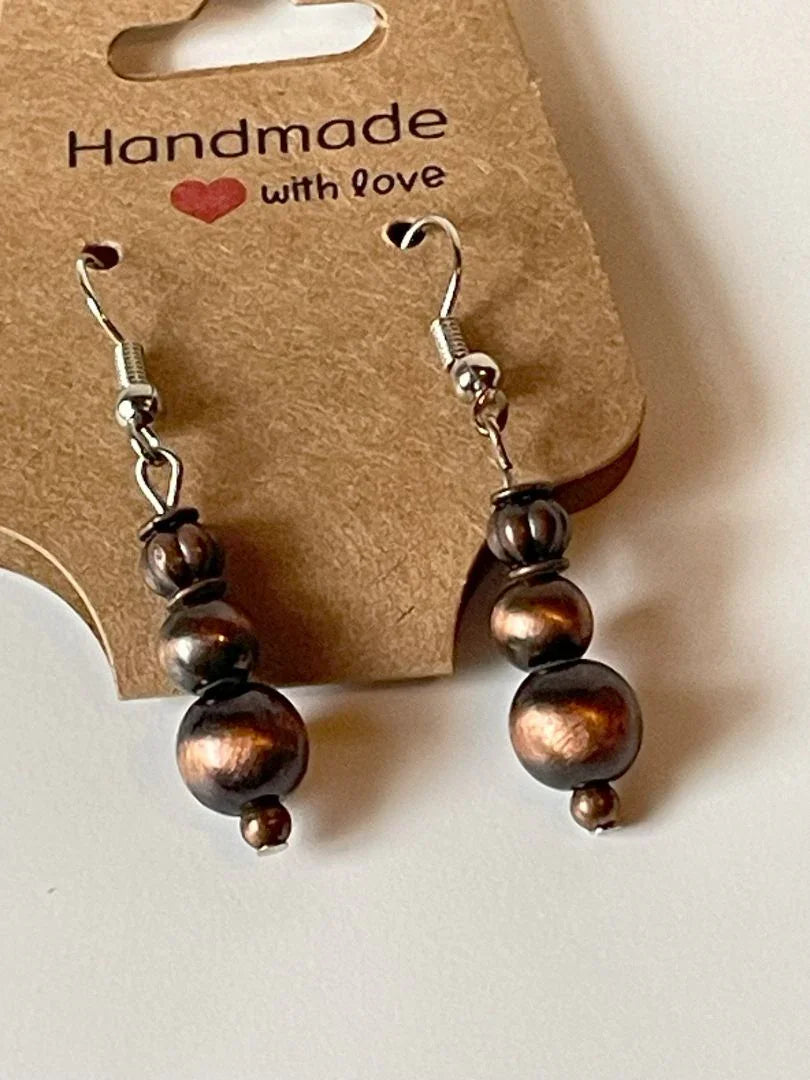 Copper bronze metal bead earrings by Sylvia Leroux, 1.5 inches long, featuring handcrafted jewelry and accessories design.