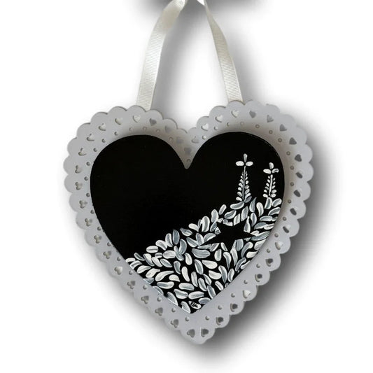 Black metal and MDF decorative heart with Talavera-inspired Mexican design, crafted by Krystal Molina.