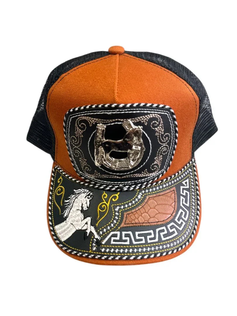 Handcrafted leather snapback hat with western style, featuring a front snap closure and cowboy-inspired design by Jose Alberto Chavez.