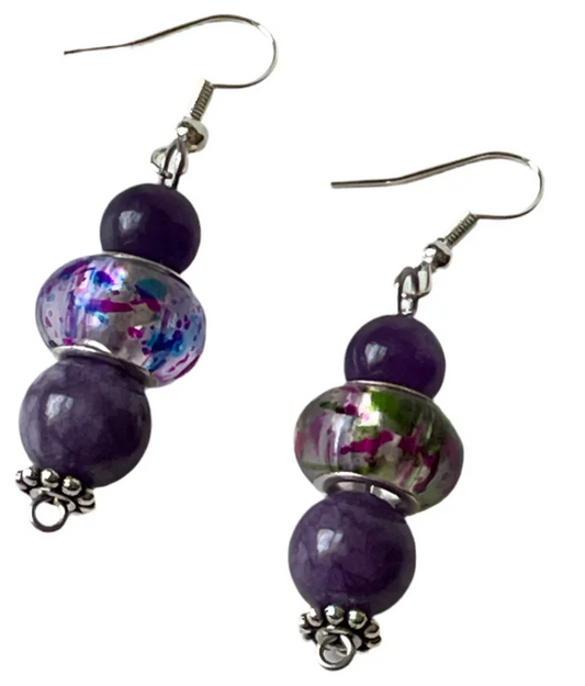 Amethyst and glass dangle earrings with purple flecked beads and silver ear hooks by Sylvia Leroux.