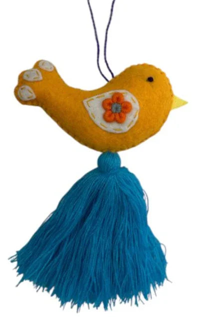 Colorful embroidered bird charm by Jose Alberto Chavez, handmade bag or car accessory with intricate stitching and vibrant details.