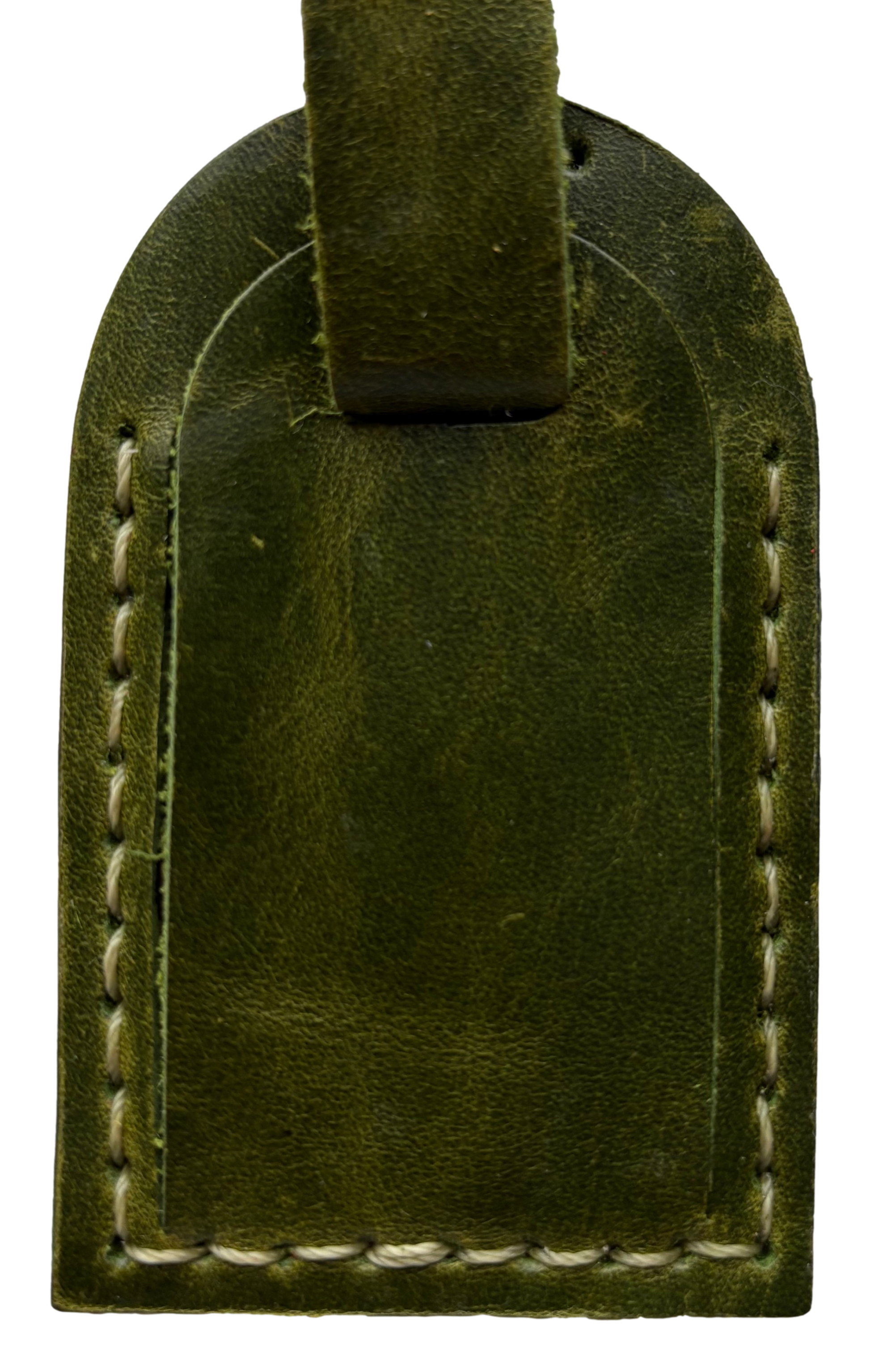 Green leather luggage tag by Consuelo Barraza, stylish accessory for travel, featuring durable material and adjustable strap.