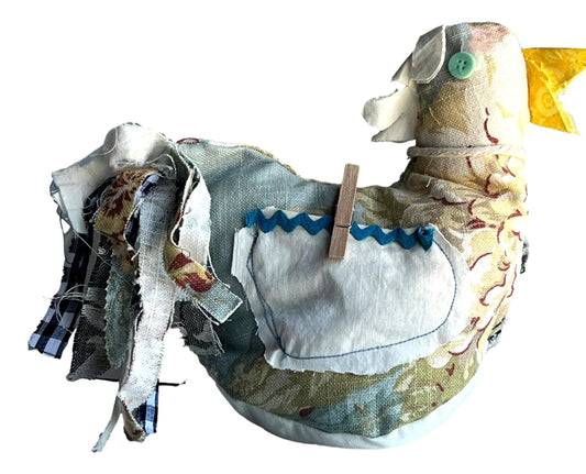 Hand-sewn chicken decor with button eyes, featuring front and back pockets, 9x7 inches, from Ysleta Mission Gift Shop.