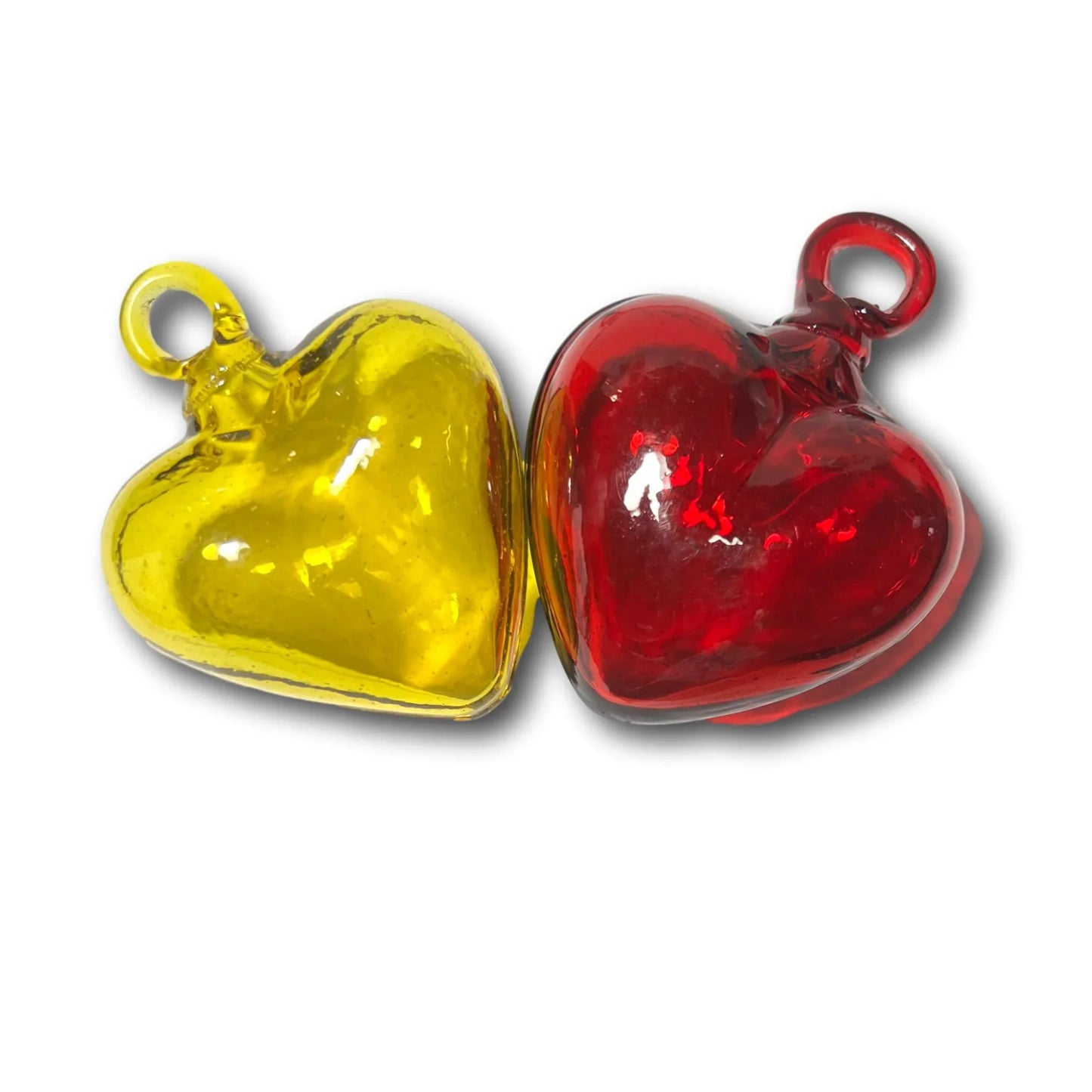 Handblown medium glass heart ornament from Ysleta Mission Gift Shop, featuring a clear, smooth surface and decorative design.