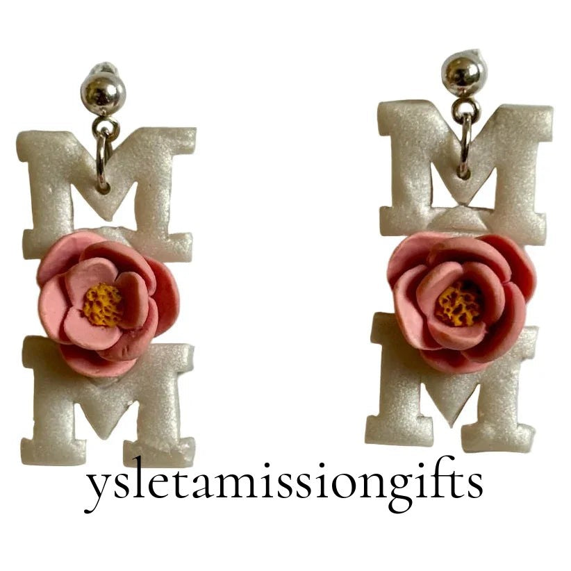 Handcrafted clay floral dangle earrings with stainless steel posts by Melissa Cortinas, featuring colorful floral design.