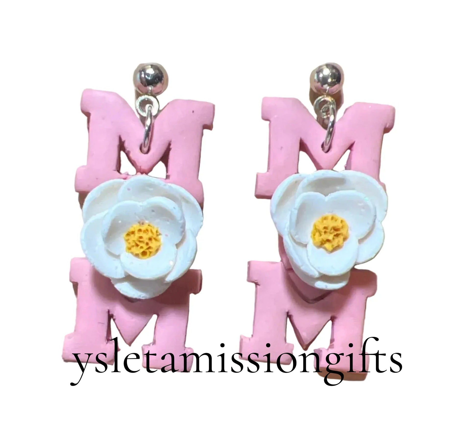 Handcrafted clay floral dangle earrings with stainless steel posts by Melissa Cortinas, featuring colorful floral designs.