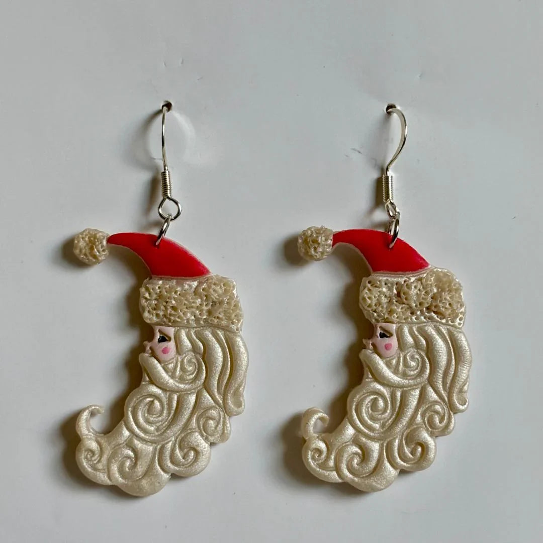 Handcrafted Clay Santa Moon Dangle Earrings with nickel-free brass hooks by Melissa Cortinas, featuring festive holiday design.