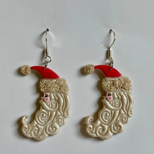 Handcrafted Clay Santa Moon Dangle Earrings with nickel-free brass hooks by Melissa Cortinas, featuring festive holiday design.