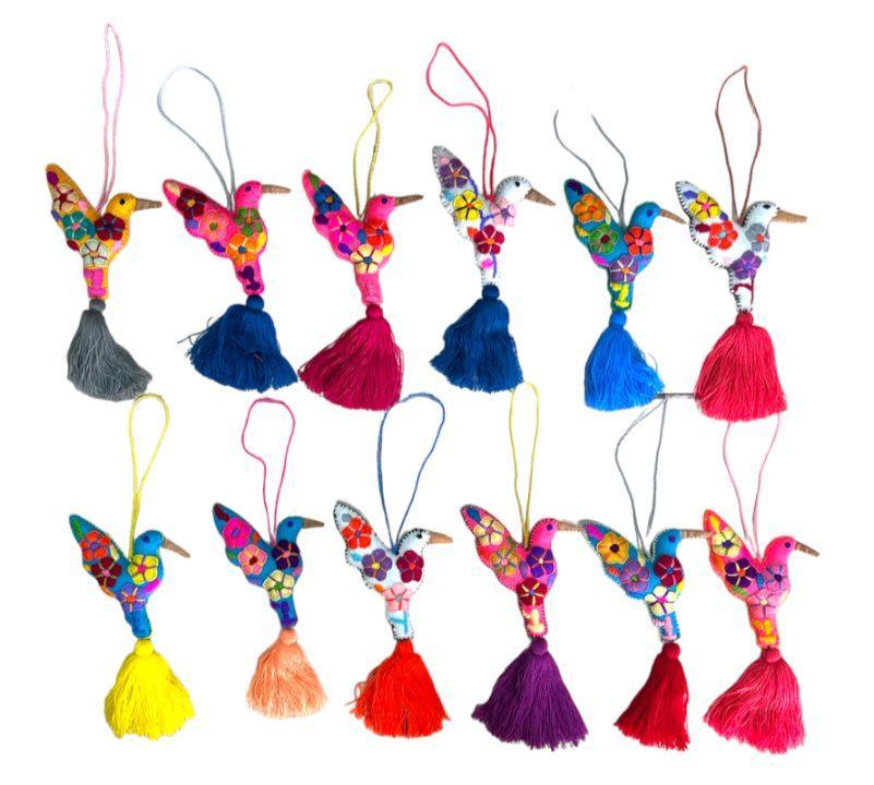 Handcrafted embroidered hummingbird artwork by Jose Alberto Chavez on a bag accessory, showcasing vibrant Mexican textile art.
