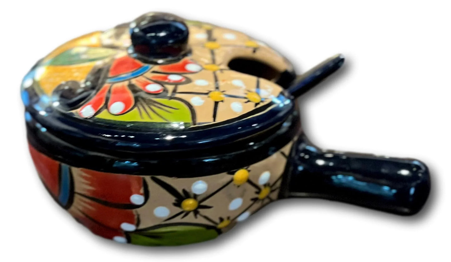 Handcrafted salsa bowl with lid and serving spoon, made of ceramic, from Ysleta Mission Gift Shop, designed for home garden use.
