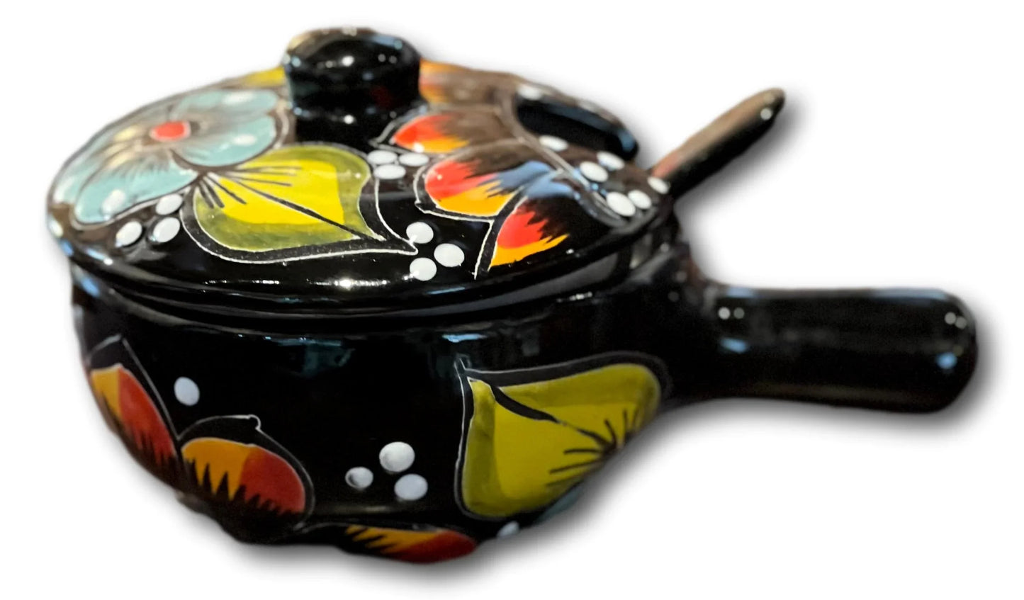 Handcrafted salsa bowl with lid and serving spoon from Ysleta Mission Gift Shop, featuring vibrant handcrafted ceramic design.