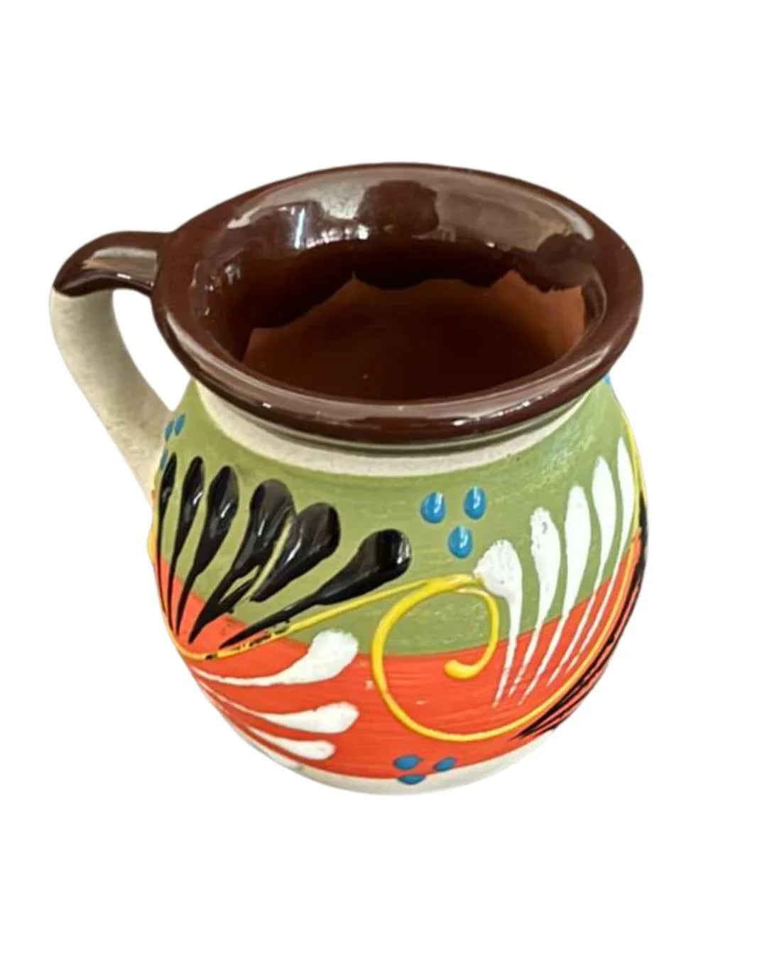 Handcrafted Talavera coffee mug with vibrant Mexican folk art patterns by Michelle Miranda, showcasing colorful pottery design.