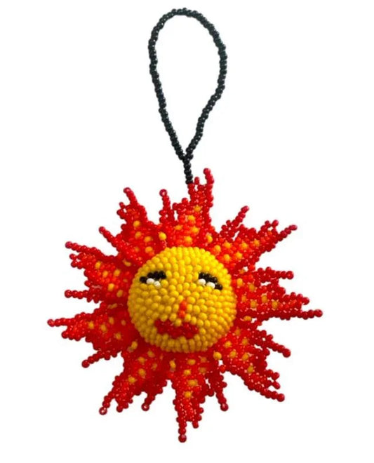 Handmade beaded sun-shaped ornament by Jose Alberto Chavez, vibrant Mexican folk art for bag decoration or wall display.