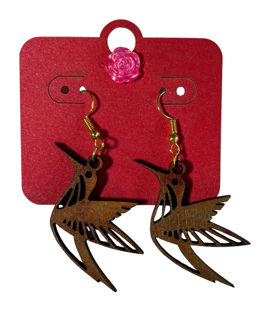 Wooden hummingbird dangle earrings by Norma Cordova De Schaefer, featuring detailed bird-shaped jewelry for accessories.