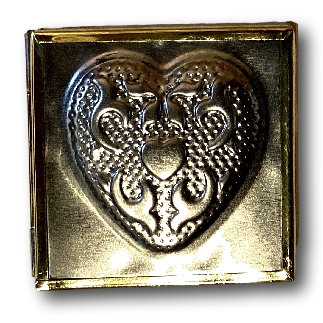 Embossed heart-shaped metal gift box from Ysleta Mission Gift Shop, 2x1.25 inches, ideal for home and garden decor.