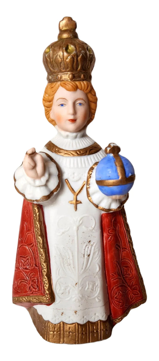 Small porcelain Infant Jesus of Prague statue, 6 inches tall, depicting the Catholic devotional figure with detailed craftsmanship.