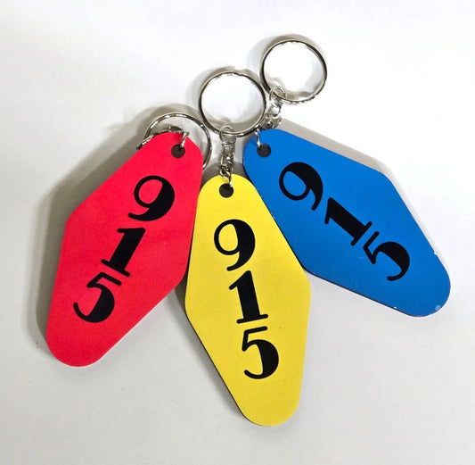 El Paso motel style welcome neon sign keychain by Vanessa Clark, two-sided sublimated souvenir accessory featuring neon design.