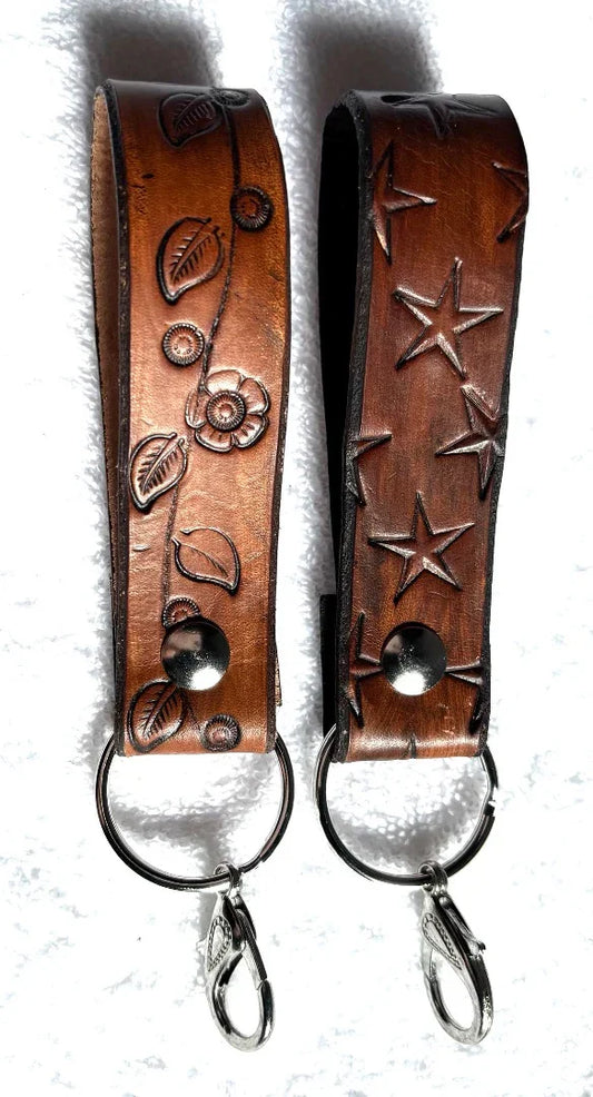 Handmade veg tan leather keychain with floral and star engraving, a stylish accessory from Consuelo Barraza.