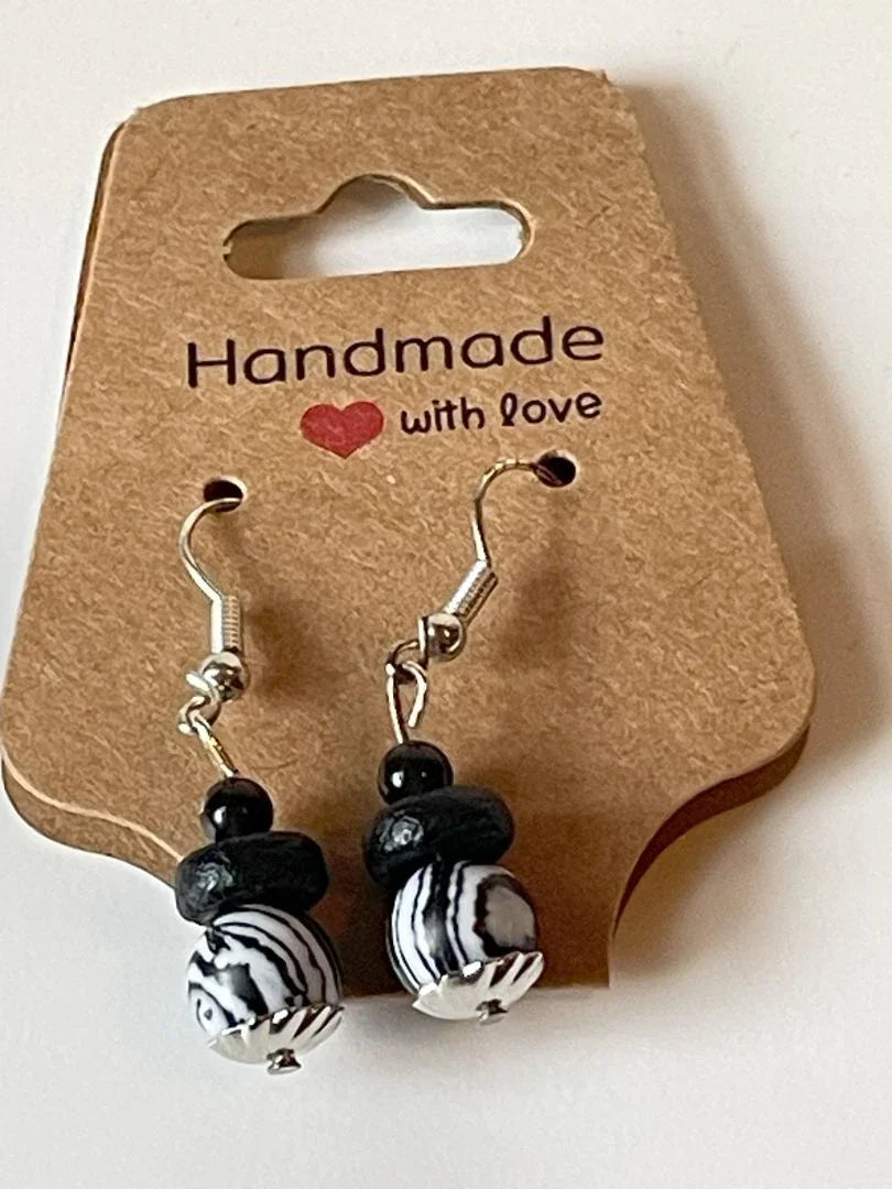 Malachite lava bead earrings by Sylvia Leroux with black and white pattern, 1.5 inches long, jewelry and accessories product image.