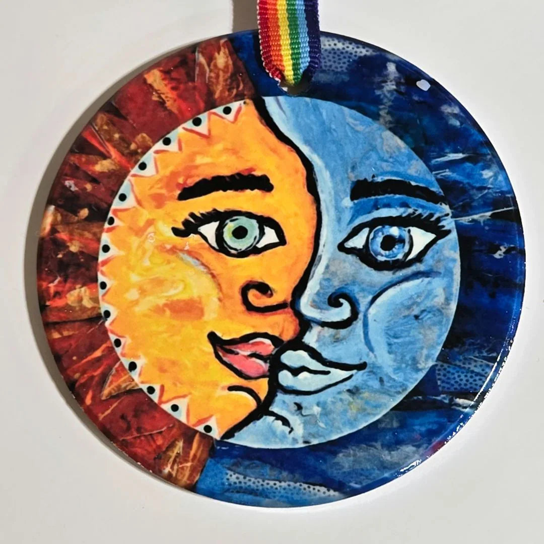 Colorful round ornament with vibrant ribbon featuring high-color original art by Vanessa Clark, perfect for decorative accents.