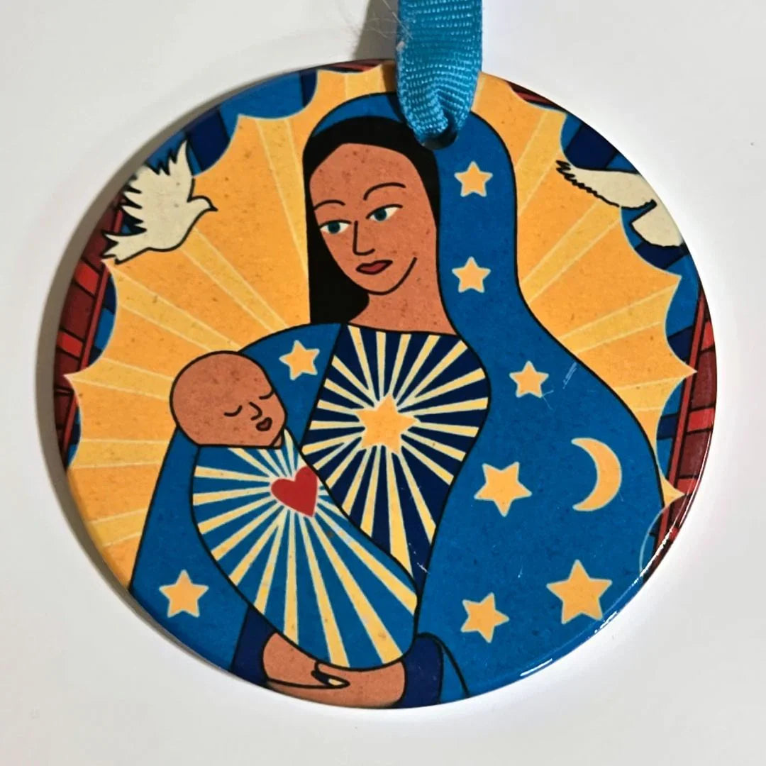 Colorful round ornament with vibrant sublimated art and ribbon detail by Vanessa Clark, ideal for decorative accents.