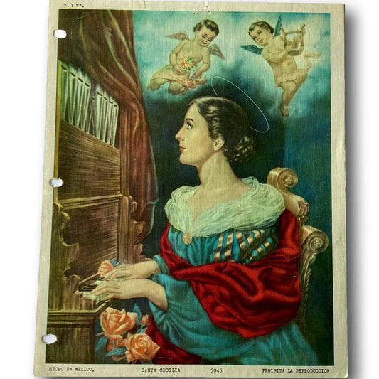 Framed religious print of Saint Cecilia, patroness of musicians, from Ysleta Mission Gift Shop, featuring Christian devotional artwork.