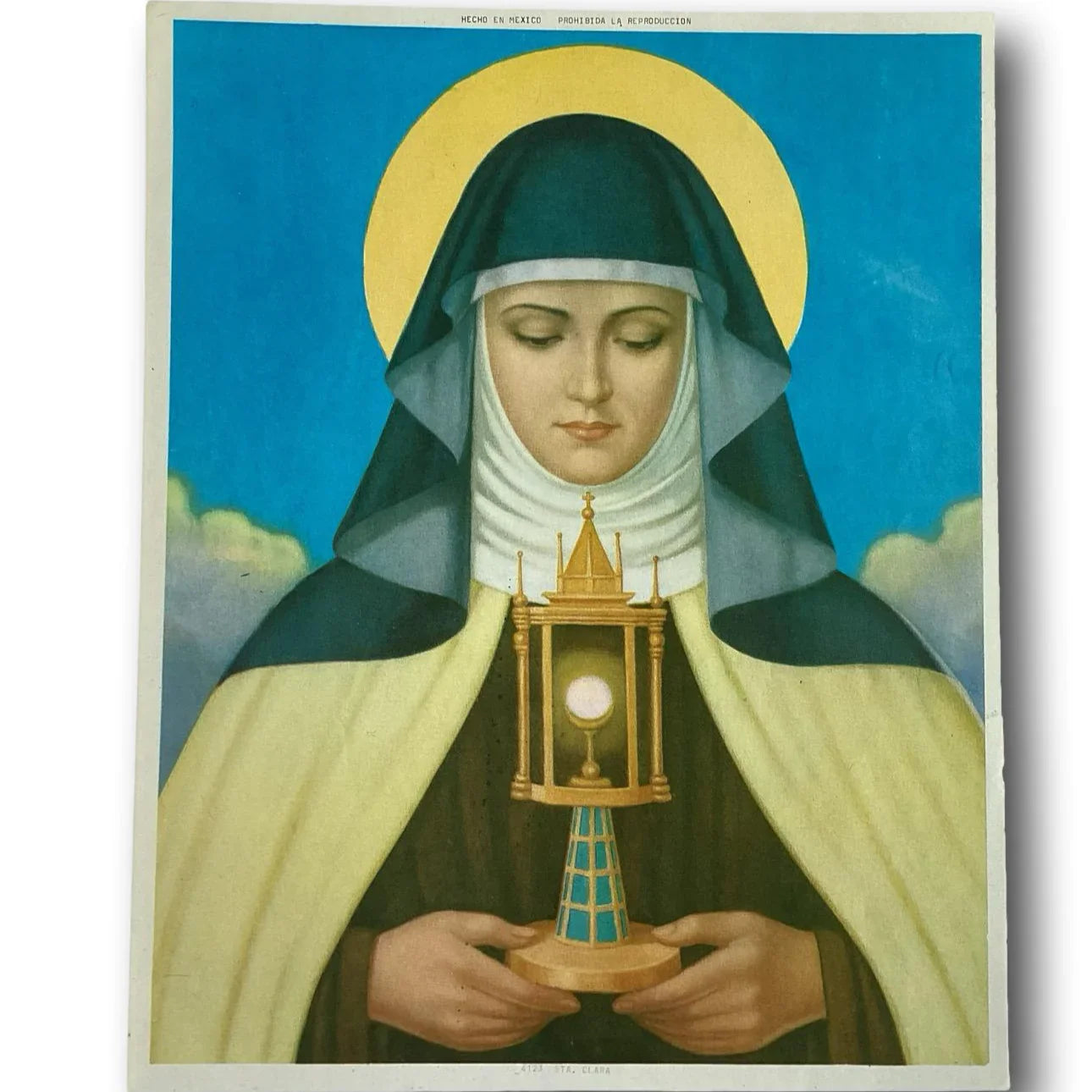 Framed religious print of Saint Clare of Assisi, Catholic devotional art depicting Eucharistic devotion, from Ysleta Mission Gift Shop.