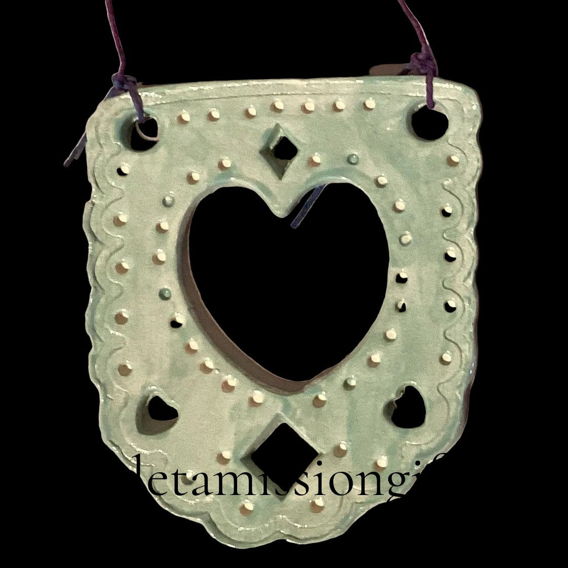 Teal ceramic ornament in papel picado style by Lorena Williams, decorative home and garden ornament with intricate cutout design.